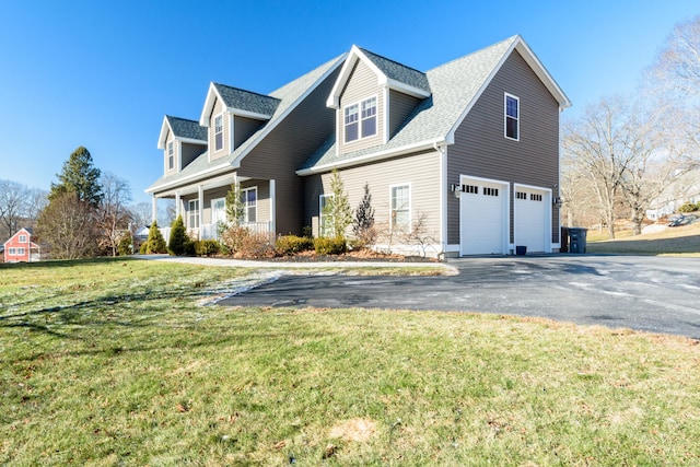 exterior space with a garage and a yard