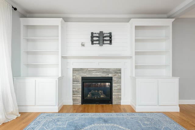 unfurnished living room featuring a fireplace, light hardwood / wood-style floors, and ornamental molding