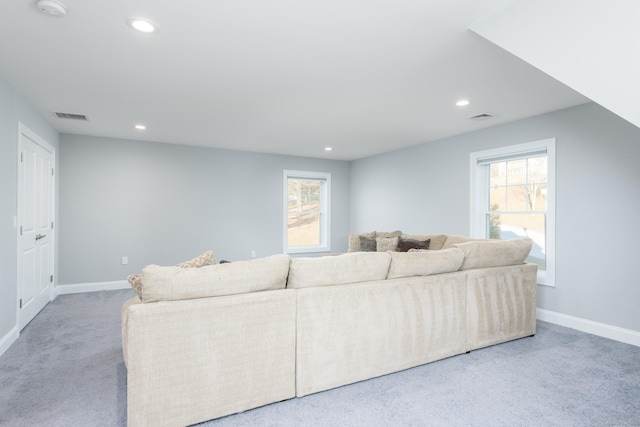 carpeted living room featuring a healthy amount of sunlight