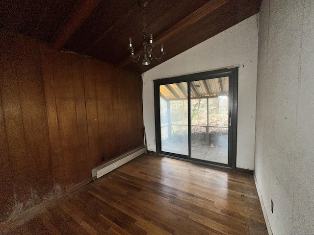 unfurnished room featuring a chandelier, vaulted ceiling with beams, dark hardwood / wood-style flooring, wooden walls, and a baseboard radiator