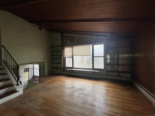 unfurnished room with hardwood / wood-style flooring, vaulted ceiling, and wooden ceiling