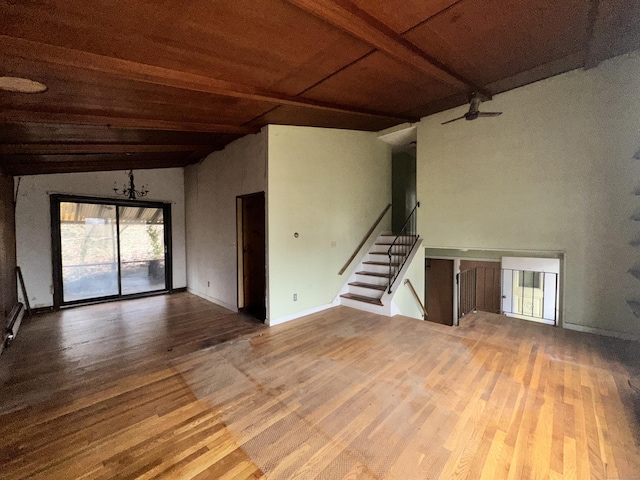 unfurnished living room with ceiling fan, wood ceiling, hardwood / wood-style floors, and vaulted ceiling with beams