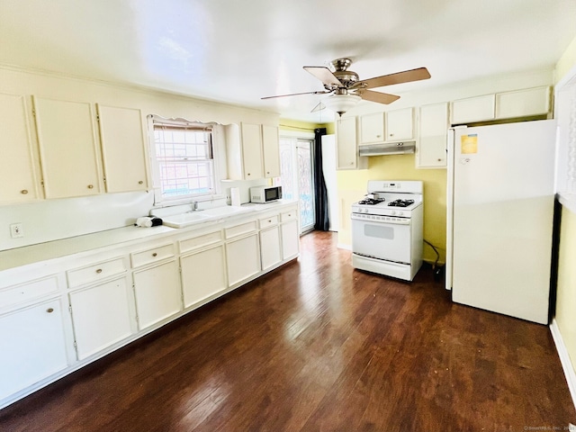 kitchen featuring ceiling fan, sink, dark hardwood / wood-style floors, white appliances, and white cabinets