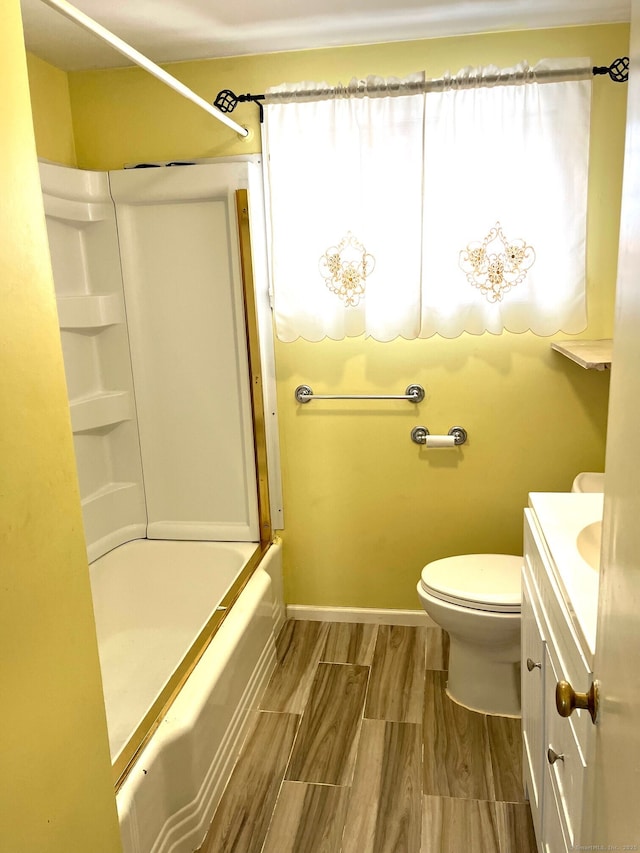 full bathroom featuring vanity, toilet, and washtub / shower combination