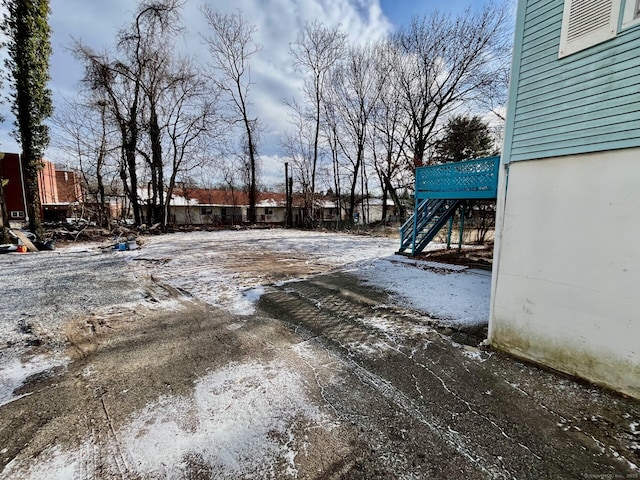 view of yard layered in snow