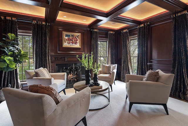 sitting room with crown molding, light carpet, wooden walls, beam ceiling, and coffered ceiling