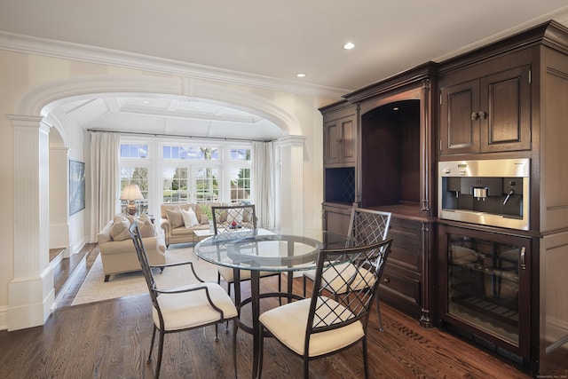39 Keelers Ridge Rd, Wilton, CT 06897 - dining room featuring crown molding, arched walkways, recessed lighting, dark wood-type flooring, and ornate columns