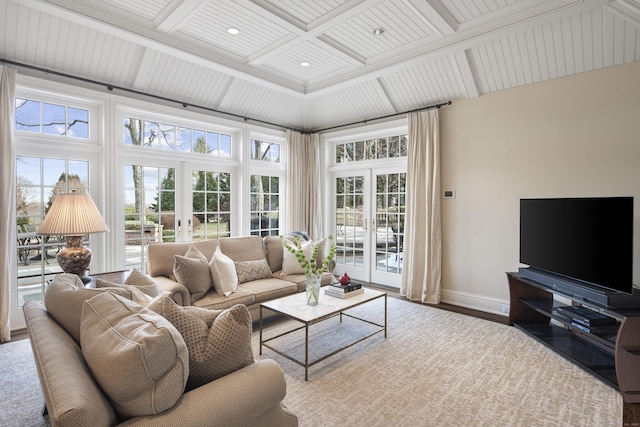 living room with coffered ceiling, french doors, and beam ceiling