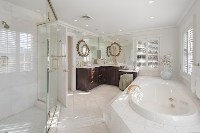 bathroom with independent shower and bath, ornamental molding, and vanity