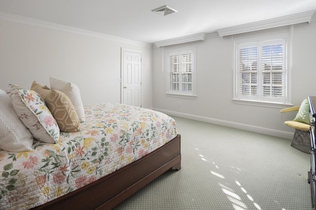 bedroom with carpet flooring and ornamental molding