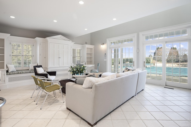 tiled living room featuring a wealth of natural light