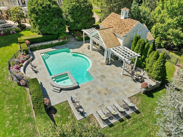 view of swimming pool featuring an in ground hot tub, a patio area, a lawn, and a pergola