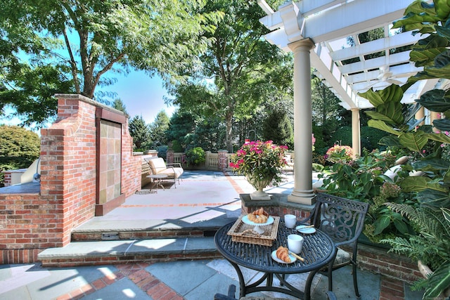 view of patio featuring a pergola