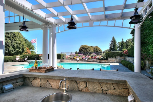 39 Keelers Ridge Rd, Wilton, CT 06897 - view of patio / terrace featuring a fenced in pool, a sink, and fence