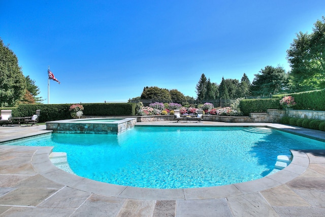 39 Keelers Ridge Rd, Wilton, CT 06897 - view of swimming pool featuring fence, a patio, and a pool with connected hot tub