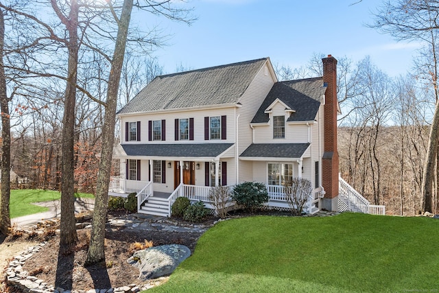 view of front of house with a front lawn and a porch