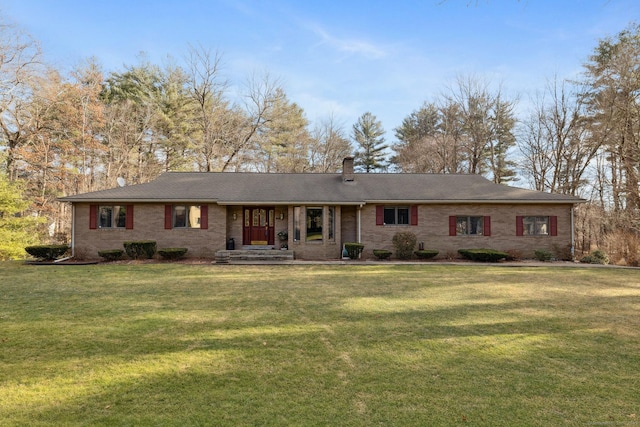 ranch-style home with a front lawn