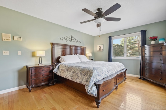 bedroom with ceiling fan and light wood-type flooring