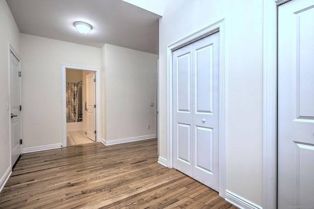 corridor featuring dark wood-type flooring