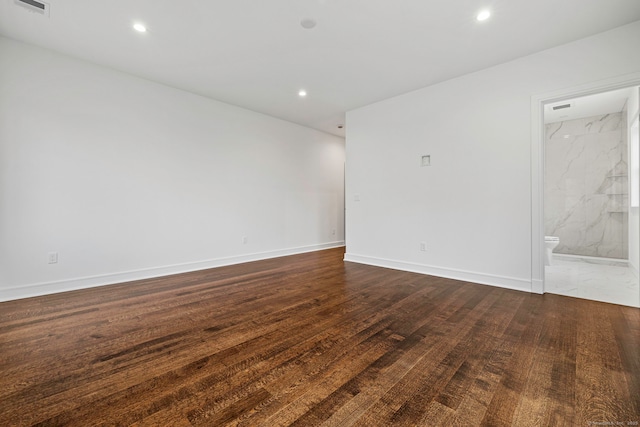 unfurnished room featuring dark hardwood / wood-style flooring