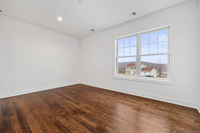 unfurnished room featuring hardwood / wood-style floors