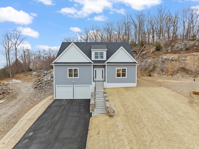 view of front of property with a garage