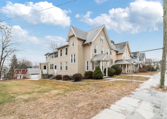 view of side of home with a lawn