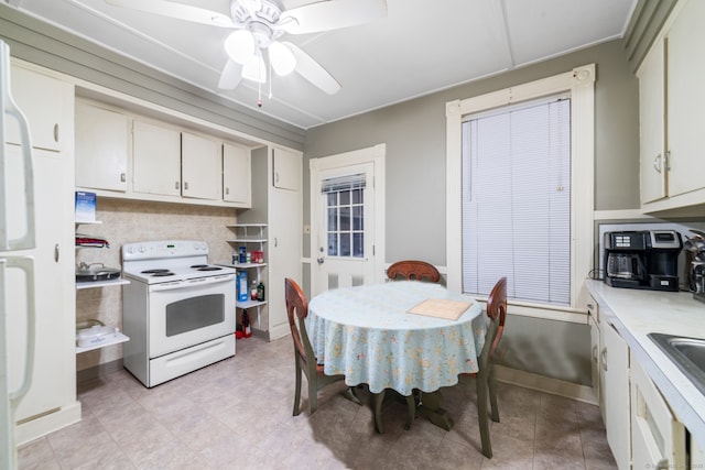 kitchen with ceiling fan, white appliances, and backsplash