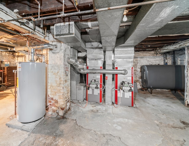 unfinished basement featuring water heater and heating fuel