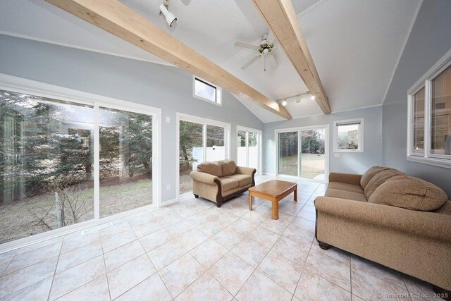 sunroom / solarium with lofted ceiling with beams, track lighting, and ceiling fan