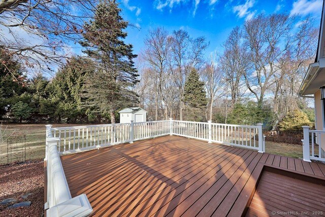 wooden deck featuring a shed