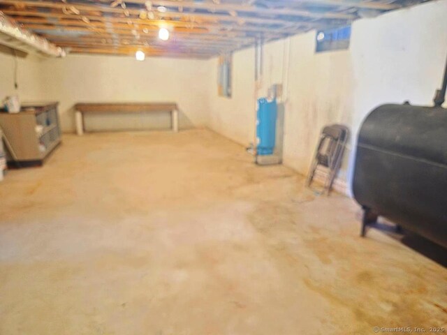 unfinished basement featuring heating fuel