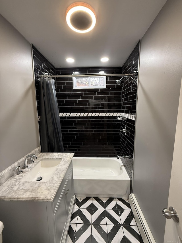 bathroom with tile patterned flooring, vanity, a baseboard radiator, and shower / tub combo with curtain