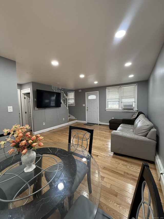 living room featuring light hardwood / wood-style floors and cooling unit