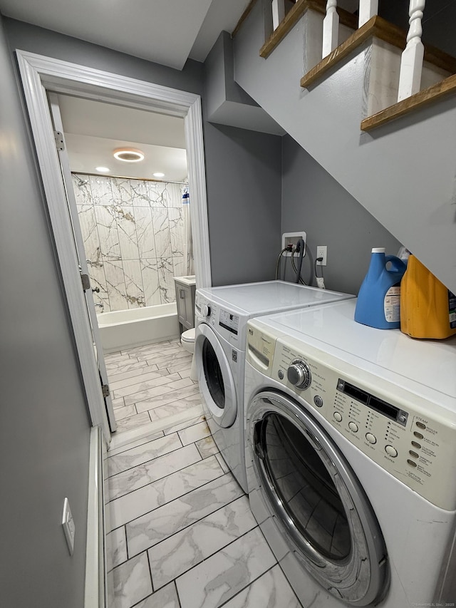 laundry room with washing machine and clothes dryer