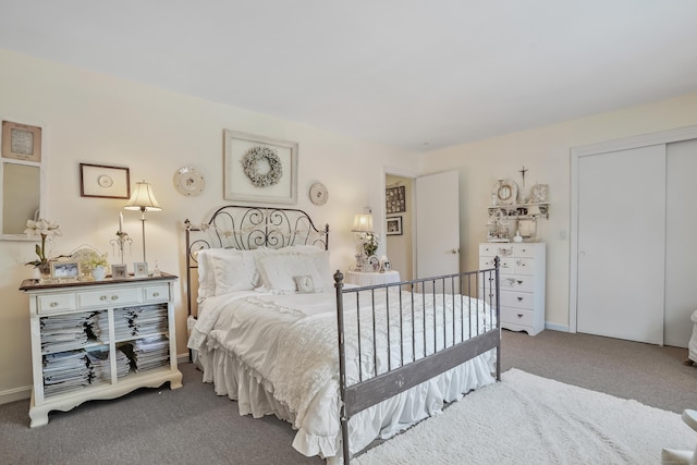 carpeted bedroom with a closet