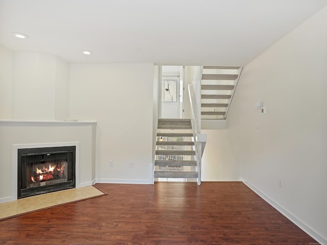 unfurnished living room featuring hardwood / wood-style flooring