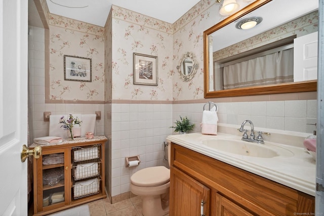 bathroom featuring tile patterned flooring, vanity, and toilet