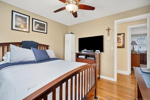 bedroom featuring light hardwood / wood-style floors and ceiling fan