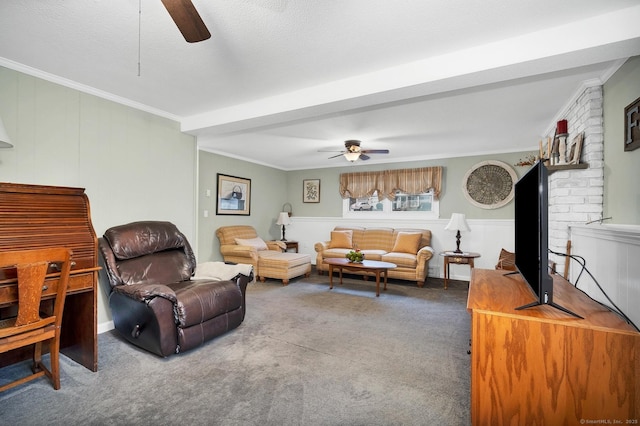 carpeted living room with beamed ceiling, ceiling fan, ornamental molding, and a textured ceiling