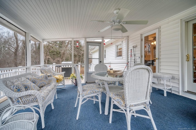 sunroom / solarium with a wealth of natural light and ceiling fan