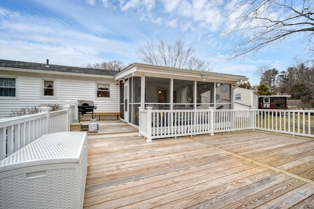 wooden terrace featuring a sunroom