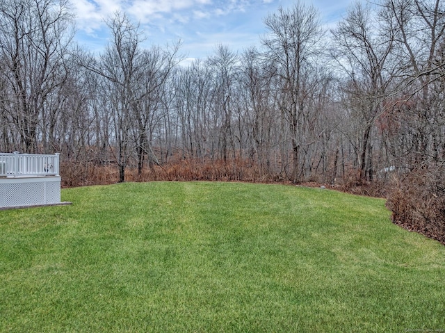 view of yard with a wooden deck