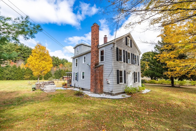 back of house with a yard