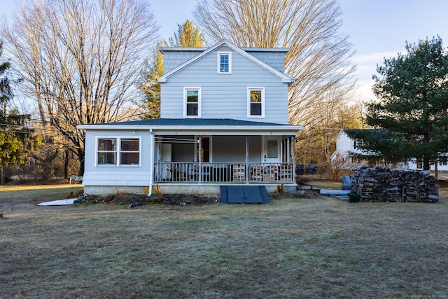 view of front of home featuring a porch and a lawn