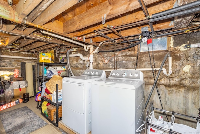 washroom with washing machine and clothes dryer