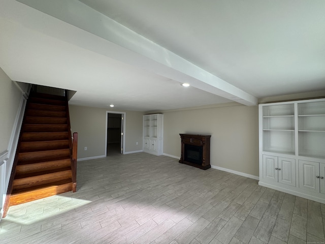 unfurnished living room featuring light wood-type flooring