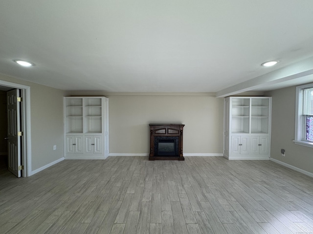 unfurnished living room with light hardwood / wood-style floors