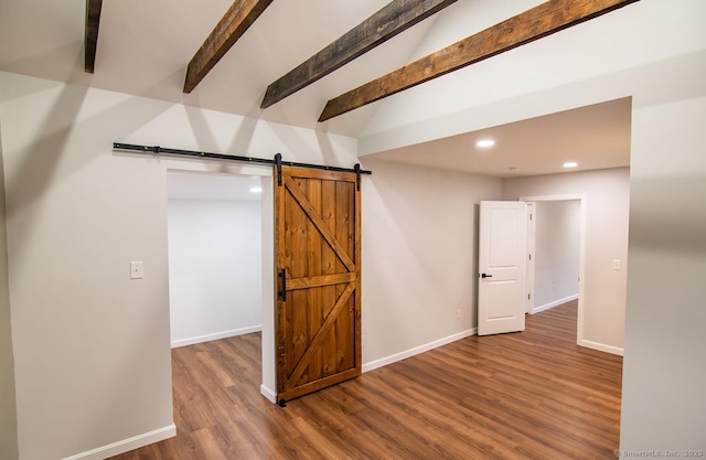 interior space featuring hardwood / wood-style flooring and a barn door