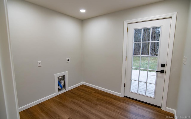 clothes washing area with hardwood / wood-style floors and hookup for an electric dryer